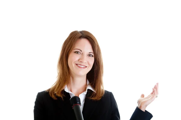 Feliz mujer de negocios caucásica sosteniendo micrófono y gestos W — Foto de Stock