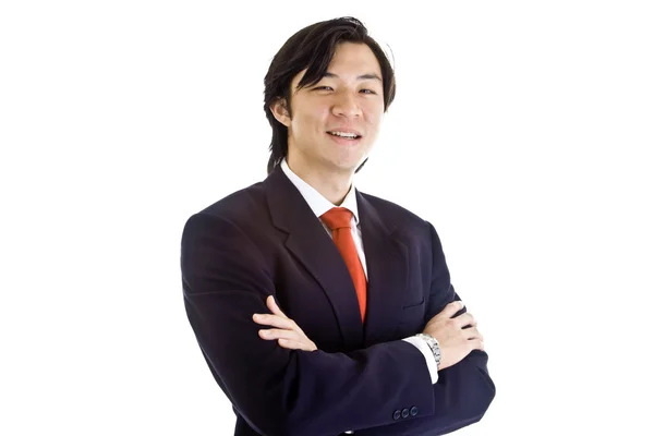 Fiducioso asiatico uomo d'affari braccia attraversato sorridente a macchina fotografica bianco — Foto Stock