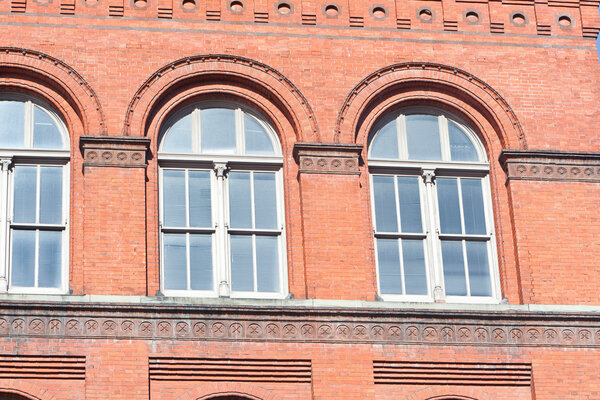 Heavy Red Brick Richardsonian Romanesque Style Windows Washington DC, part of a federal office building.
