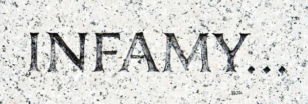 Word "Infamy" Carved in Gray Granite Pearl Harbor — Stock Photo, Image