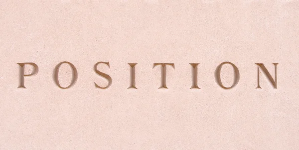 Η λέξη "θέση", λαξευμένη σε πέτρα ψαμμίτη — Φωτογραφία Αρχείου