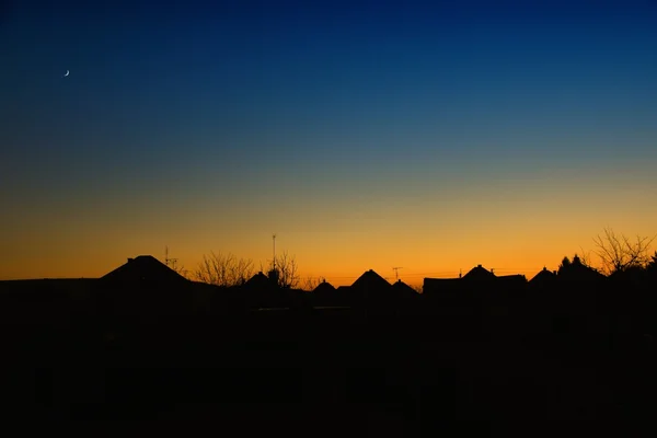 Sunset over the houses — Stock Photo, Image
