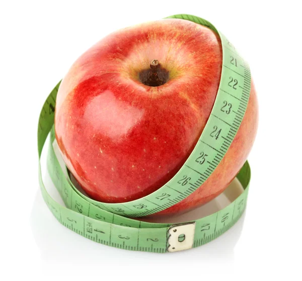 Яблоко с измерительной лентой — стоковое фото
