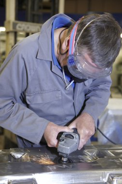 Worker with angle grinder clipart