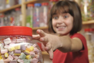 Girl in sweet shop clipart