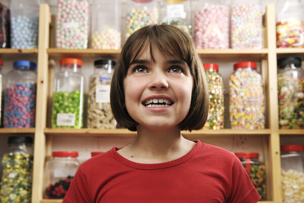 Girl in sweet shop