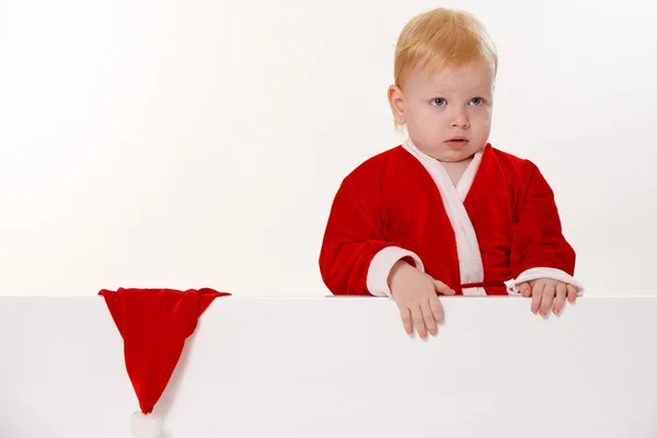 Criança vestida de Papai Noel — Fotografia de Stock