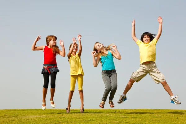 Fun group of kids jumping — Stock Photo, Image
