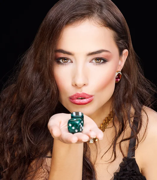 Woman holding dices on black background — Stock Photo, Image