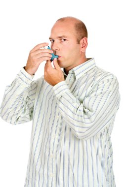 Man holding asthma medicine inhaler with both hands clipart