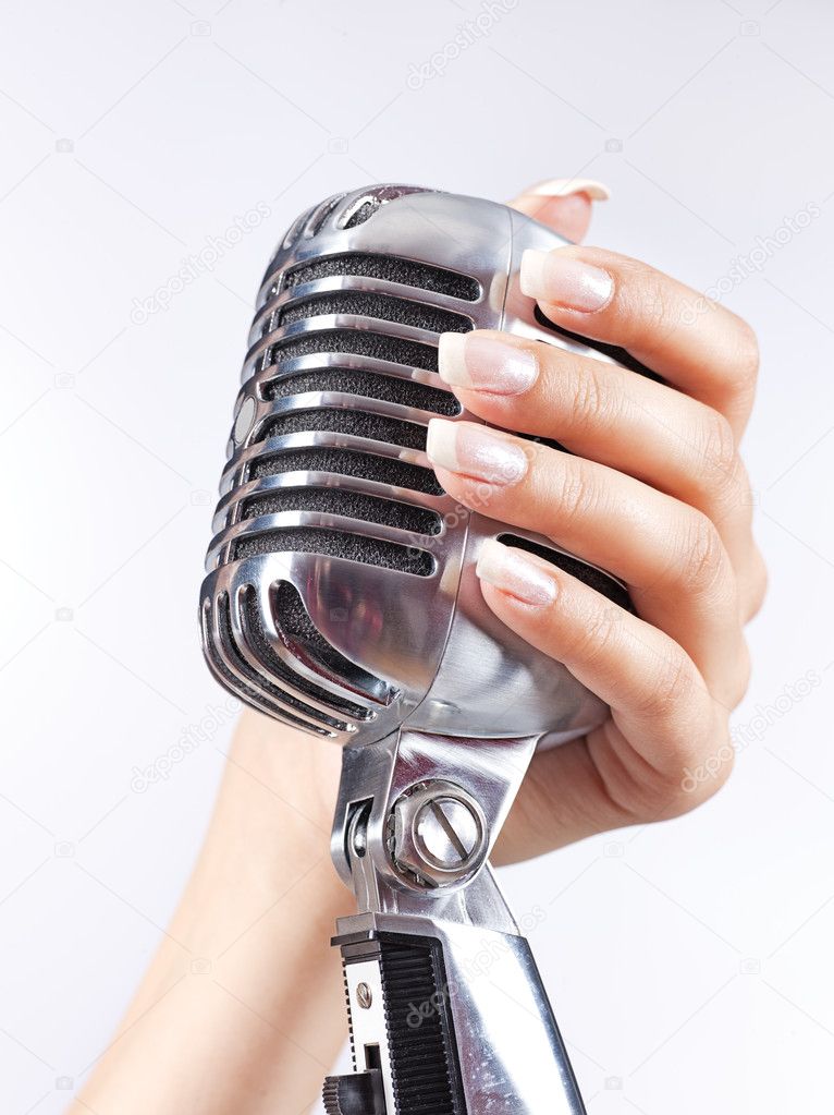 Big microphone in woman's hand