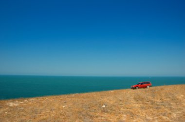 Red car on the slope clipart