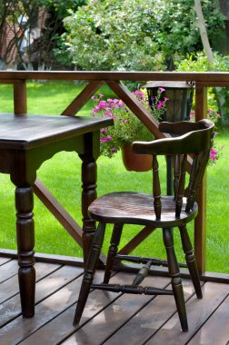 Open air cafe with lots of green plants clipart