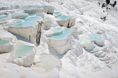 Blue water travertine pools at Pamukkale, Turkey clipart