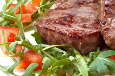 Beef steak with rocket salad clipart