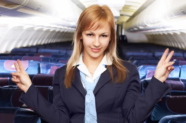 Blond lucht gastvrouw (stewardess) — Stockfoto