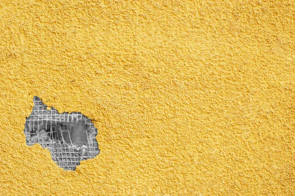 Yellow punched stucco — Stock Photo, Image