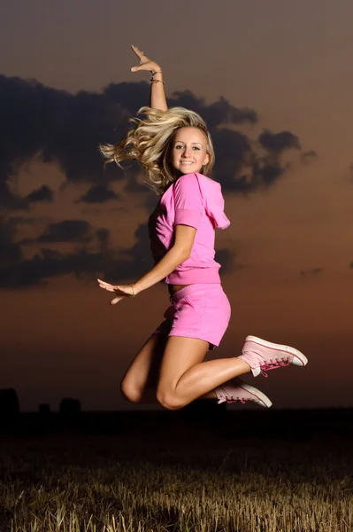 Girl outdoor jumping — Stok Foto