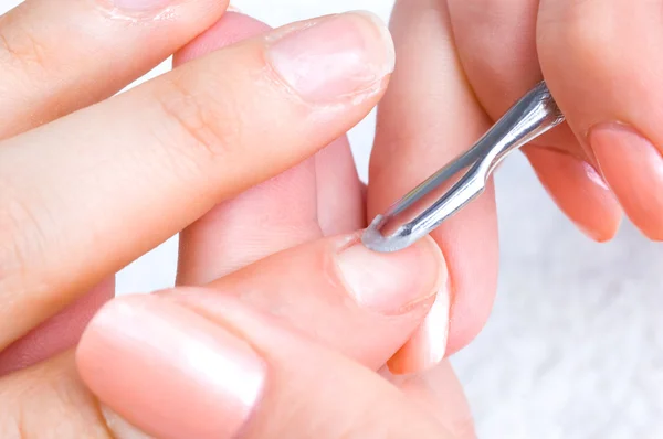Manicure applying - cleaning the cuticles — Stock Photo, Image