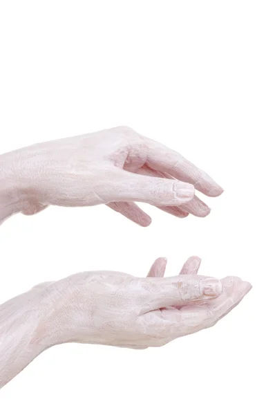 Crème op de handen, geïsoleerd — Stockfoto