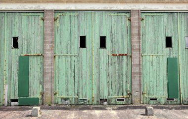 Large doors of garage for military vehicles clipart