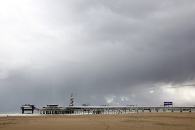 Pier of Scheveningen with grey sky clipart