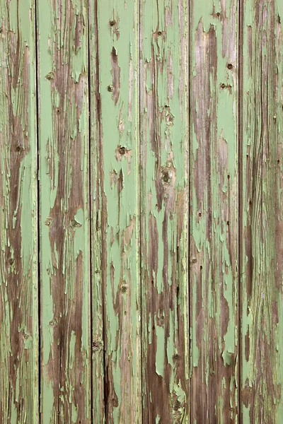 Old wooden door with peeling paint — Stock Photo, Image