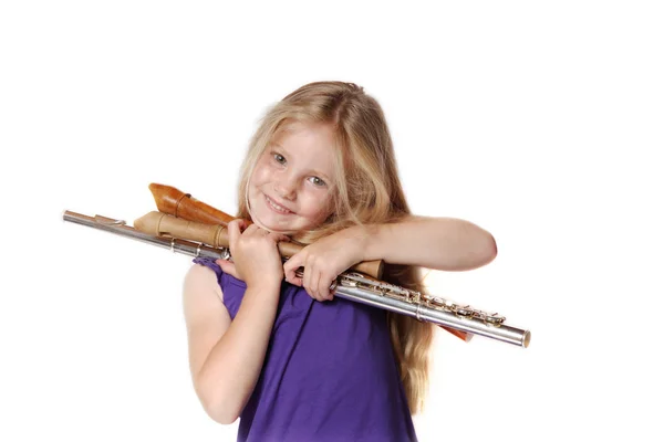 Девочка и музыкальные инструменты — стоковое фото