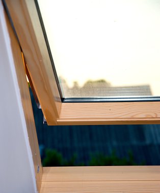 Open roof window in new house. clipart