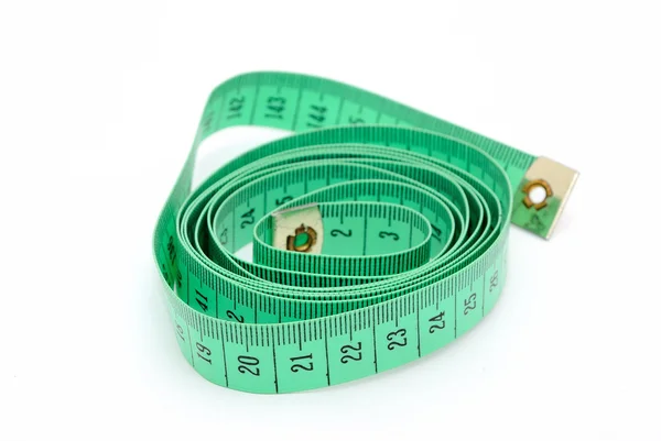 Detail foto van gedraaide groene inch tape. — Stockfoto