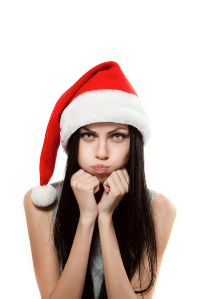 Girl is offended in Santa Claus hat — Stock Photo, Image