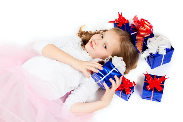 A little girl with the gifts — Stock Photo, Image