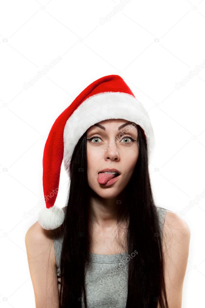 Girl in Santa Clause hat put out one's tongue