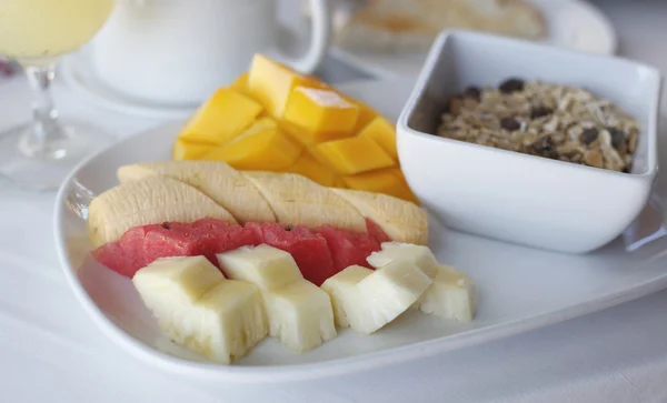 stock image Healhty breakfast with assortment of fresh fruits, cereal muesli and fresh