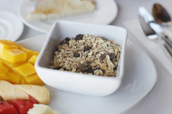 stock image Healthy breakfast with cereal muesli and assortment of fresh fruits and pou