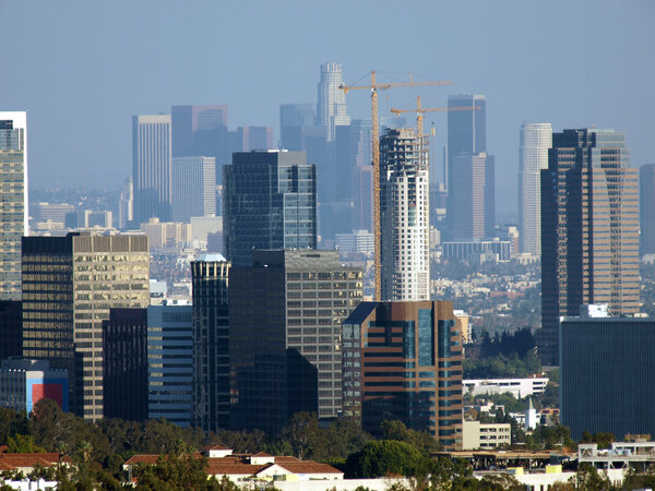 Century City and Downtown Los Angeles form a double skyline in the afternoon sun.