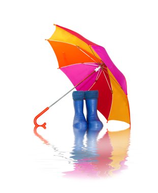 Rubber boots and a colorful umbrella with reflection in water clipart