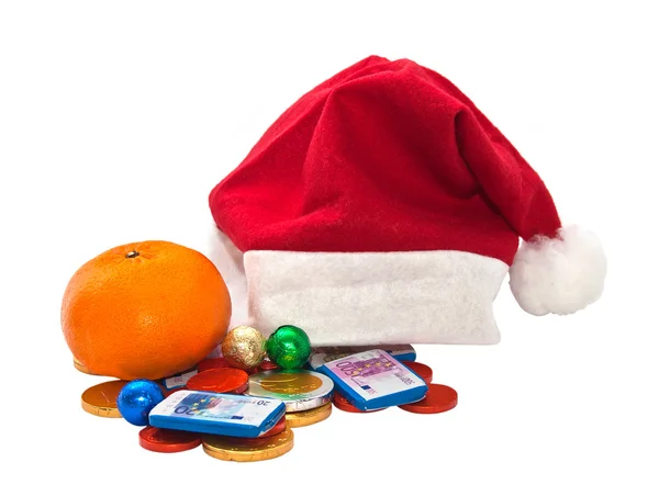 Santa Claus hat with chocolate money. — Stock Photo, Image