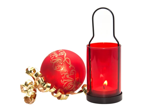 Red candle with Christmas ball isolated on white background. — Stock Photo, Image