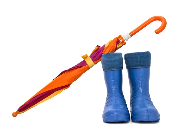Rubber boots and a colorful umbrella isolated on a white background. — Stock Photo, Image