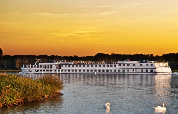 stock image Passenger boat sailing down the river at sunset