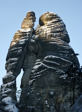 Man and woman silhouette in Rock Town, Czech Republic clipart