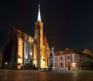 Church and monument at night. They are located on island in the middle of W clipart