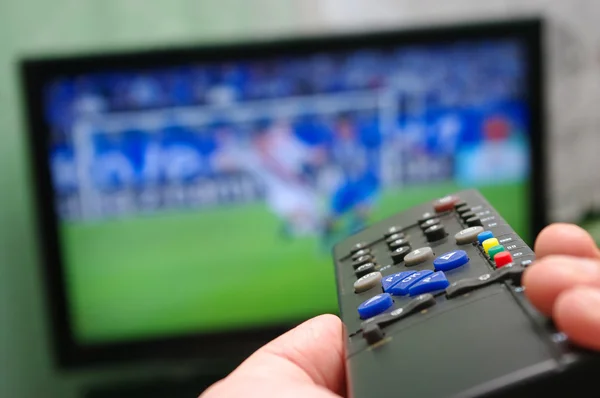 Football match and remote control — Stock Photo, Image