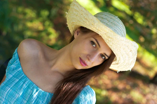 Girl in blue dress and hat — Stock Photo, Image