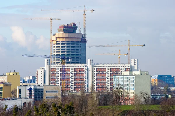 Big building under construction with few cranes — Stock Photo, Image
