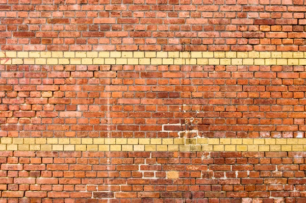 Old yellow striped brick wall — Stock Photo, Image