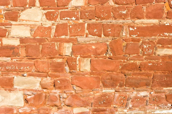 Ściana pod kątem tekstura tło z czerwonego piaskowca skały — Zdjęcie stockowe