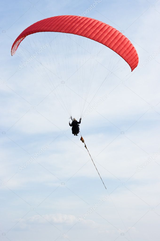 Red paraglider on the rope