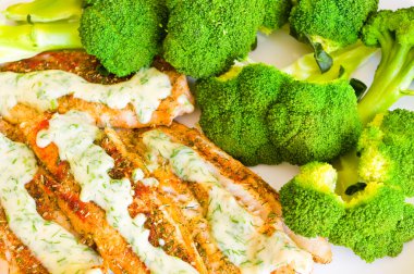 Fish with broccoli and dill sauce clipart